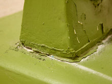 Load image into Gallery viewer, Close-up of a painted green corner joint with peeling paint and rough, weathered edges.