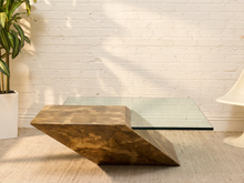 Load image into Gallery viewer, Postmodern sculptural coffee table with clear square glass top and angular mottled brown, taupe, and cream architectural base.