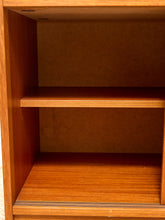 Load image into Gallery viewer, Close-up of the interior of a wooden cabinet or shelf unit with two shelves, showing warm medium-brown wood grain and a plain back panel.