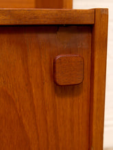 Load image into Gallery viewer, Close-up of a warm medium-brown wooden cabinet or drawer with a square wooden pull handle, showing the wood grain and a small scuff on the front panel.