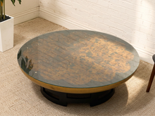 Load image into Gallery viewer, Circa-1950 Muller & Barringer for Kittinger round coffee table with black lacquer top and large mottled brown scalloped medallion.