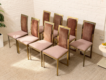 Load image into Gallery viewer, Set of eight vintage 1970s dining chairs with polished brass-tone geometric frames, brown upholstered backs, and light upholstered seats.