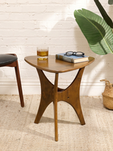 Load image into Gallery viewer, Mid-century style walnut side table with softly triangular biomorphic top, sculptural flared base, and warm wood finish.