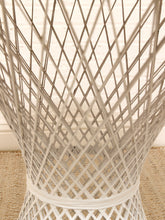 Load image into Gallery viewer, Close-up of a white woven wire chair or stool with a diamond lattice pattern, set on a beige textured rug against a light wall.