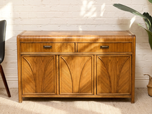 Load image into Gallery viewer, Vintage wood credenza with two upper drawers, four sculpted geometric cabinet doors, recessed pulls, and rounded top corners