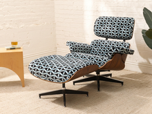 Load image into Gallery viewer, Mid-century style lounge chair and matching ottoman with molded wood frame and blue geometric patterned upholstery