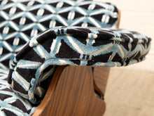 Load image into Gallery viewer, Close-up of a patterned cushion on a wooden chair, featuring a black, light blue, and cream geometric design.