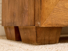 Load image into Gallery viewer, Close-up of a wooden furniture piece showing the block-style legs and wood grain on a light beige carpet.