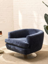 Load image into Gallery viewer, Vintage blue velvet swivel lounge chair with curved barrel back, rounded arms and plush seat cushion