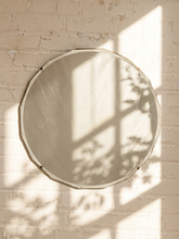 Load image into Gallery viewer, Vintage Art Deco frameless wall mirror with a faceted octagonal silhouette and wide beveled glass edge.