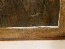 Load image into Gallery viewer, Close-up of an antique framed painting showing a dark brown painted surface, a textured burlap mat, a wooden frame, and a white painted brick wall below.