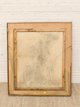 Load image into Gallery viewer, The back of a vintage wooden framed canvas painting, showing the textured canvas backing and frame, leaning against a white brick wall on a woven rug.