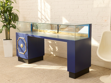 Load image into Gallery viewer, 1960s vintage jewelry display case with long glass showcase, pedestal base, and decorative gold detailing