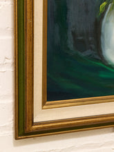 Load image into Gallery viewer, A close-up of a framed painting hanging on a white brick wall, showing the ornate gold frame, cream mat, and dark green and gray painted artwork.
