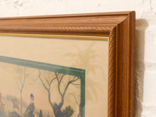 Load image into Gallery viewer, Close-up of a framed art print showing a warm brown wood frame, cream matting, and a vintage-style equestrian illustration on a textured off-white wall.