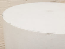 Load image into Gallery viewer, A close-up of a cylindrical white textured product, showing a fine woven or canvas-like surface with a slightly rough, painted finish against a light neutral background.