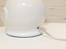 Load image into Gallery viewer, Close-up of a glossy white ceramic lamp base with a clear cord exiting from the side, set against a light textured background.