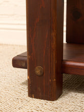 Load image into Gallery viewer, Close-up of a dark brown wooden table leg with a round metal screw detail, resting on a textured beige woven rug.