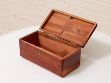 Load image into Gallery viewer, An open rectangular wooden keepsake box with a hinged lid, made of reddish-brown wood, resting on a white surface against a white brick wall background.