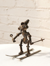 Load image into Gallery viewer, Vintage Brutalist metal skier sculpture made from welded springs, nuts, bolts, and repurposed industrial hardware