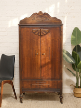 Load image into Gallery viewer, Antique carved wood drop-front secretary cabinet with decorative fan motif and turned feet