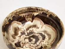 Load image into Gallery viewer, A close-up of a handmade ceramic bowl with a marbled swirl pattern in dark brown and cream glaze, set against a neutral off-white background.