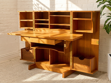 Load image into Gallery viewer, Vintage Danish Modern teak transformer desk cabinet with two paneled doors, recessed pulls, and warm natural wood grain