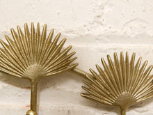 Load image into Gallery viewer, Vintage brass-tone wall hook rack with connected fan-shaped motifs and curved clothing hooks