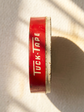 Load image into Gallery viewer, Vintage red Tuck Tape No. 200 cellophane tape round container with black and white advertising graphics
