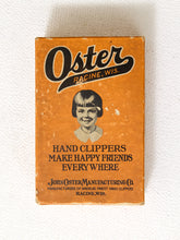 Load image into Gallery viewer, Vintage orange Oster hand clippers advertising box with illustrated portrait and John Oster Manufacturing Co. Racine Wisconsin branding