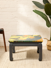 Load image into Gallery viewer, Vintage square side table with swirling yellow, orange, teal, and black marbled abstract top and dark curved-leg base