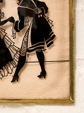 Load image into Gallery viewer, Vintage framed silhouette artwork of elegantly dressed Victorian-style couple in black on a blush background with gold-tone frame