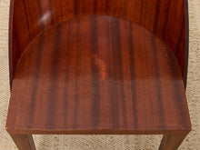 Load image into Gallery viewer, Close-up of a wooden chair seat and curved backrest in a rich reddish-brown mahogany finish, resting on a beige textured carpet.