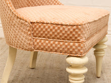 Load image into Gallery viewer, Peach checkered upholstered Hollywood Regency slipper chair with tall arched back, cushioned seat, and cream-painted legs