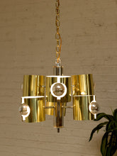 Load image into Gallery viewer, Vintage Space Age chandelier with polished brass cylindrical shades, mirrored chrome spheres, multiple lights, and chain suspension