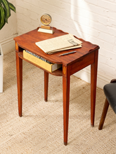 Load image into Gallery viewer, Vintage mahogany-toned console table with scalloped gallery top, open shelf, tapered legs, and decorative floral-style inlay details