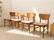 Load image into Gallery viewer, Set of four vintage Mid-Century wood dining chairs with curved backrests, tapered legs, faded upholstered seats, and two chairs with arms