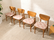 Load image into Gallery viewer, Set of four vintage Mid-Century wood dining chairs with curved backrests, tapered legs, faded upholstered seats, and two chairs with arms