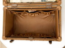 Load image into Gallery viewer, An open vintage brown suitcase or trunk with a brown fabric lining, ruffled trim, and metal hinges, photographed from above on a white background.