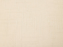 Load image into Gallery viewer, A close-up of a textured cream-colored fabric with a subtle woven grid pattern.
