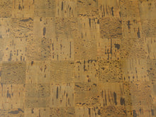 Load image into Gallery viewer, A close-up of a cork surface with a patchwork of rectangular cork tiles in warm tan, beige, and brown tones with dark brown to black natural fissures and grain.