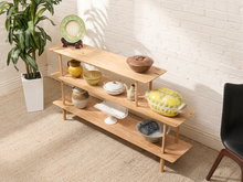 Load image into Gallery viewer, Vintage three-tier natural wood display shelf with long staggered shelves, rounded edges, slender dowel supports, and visible wood grain