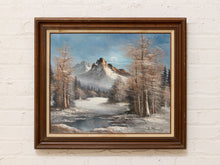 Load image into Gallery viewer, Vintage framed winter landscape painting with snow-covered mountains, winding river, tall trees, pale moon, and blue sky