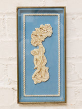 Load image into Gallery viewer, Vintage framed gold-tone cherub relief with floral ornament on blue background and decorative rope border