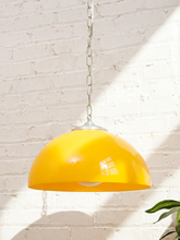 Load image into Gallery viewer, Vintage mustard yellow hanging pendant lamp with rounded dome metal shade, exposed white globe bulb, and chain suspension