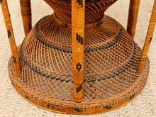 Load image into Gallery viewer, Close-up of a woven rattan or wicker chair base with vertical legs and circular slatted platform, shown on a light textured surface.