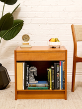 Load image into Gallery viewer, Danish mid-century modern wood nightstand with slim upper drawer, open lower shelf, warm wood finish, and clean rectangular silhouette