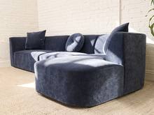 Load image into Gallery viewer, Bonnie three-piece sectional sofa in Amici Indigo blue upholstery with left-arm-facing loveseat, armless section, right-arm-facing chaise, and loose pillows