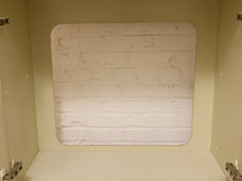 Load image into Gallery viewer, A square foam insert with rounded corners featuring a white painted brick pattern, shown inside a beige plastic storage cabinet or organizer.