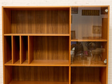Load image into Gallery viewer, A mid-century modern wooden display cabinet with a warm brown wood-grain finish, featuring open shelves on the left and glass-front cabinets on the right with small silver knobs.